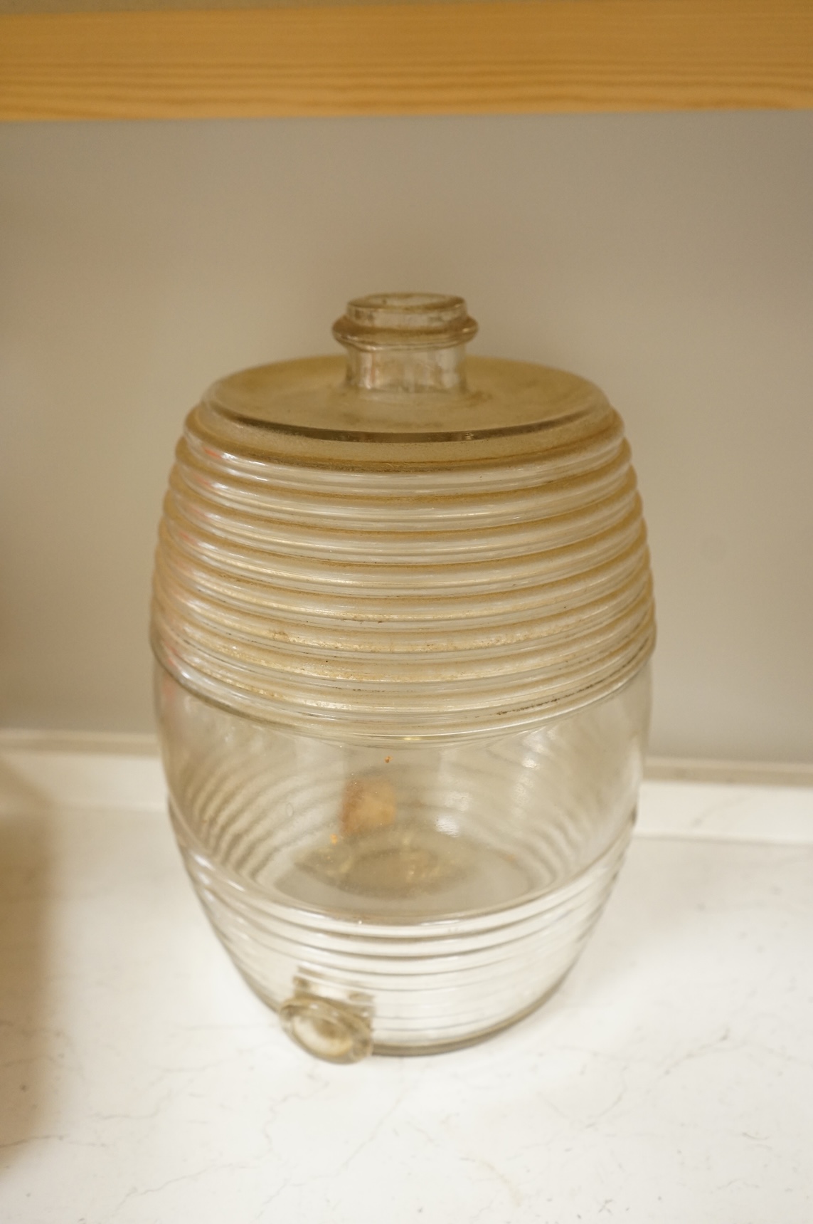 A Victorian glass spirit barrel, converted to a lamp base, together with a pair of embossed sheet-brass heraldic plaques and a replica coin set box